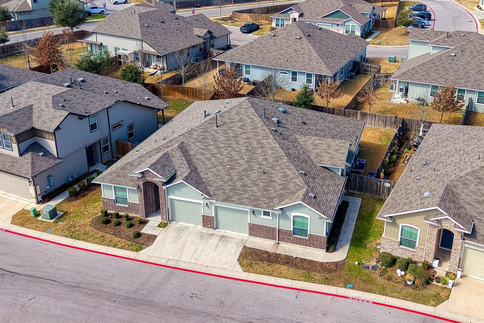 14409 Frankel Loop, Unit 33A Pflugerville, TX 78660 - Photo 26 of 28 an aerial view of a house with a garden and parking space