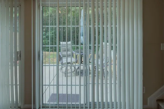 a view of an empty room with stairs