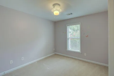 an empty room with closet area