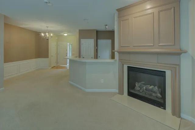a view of an empty room with a fireplace