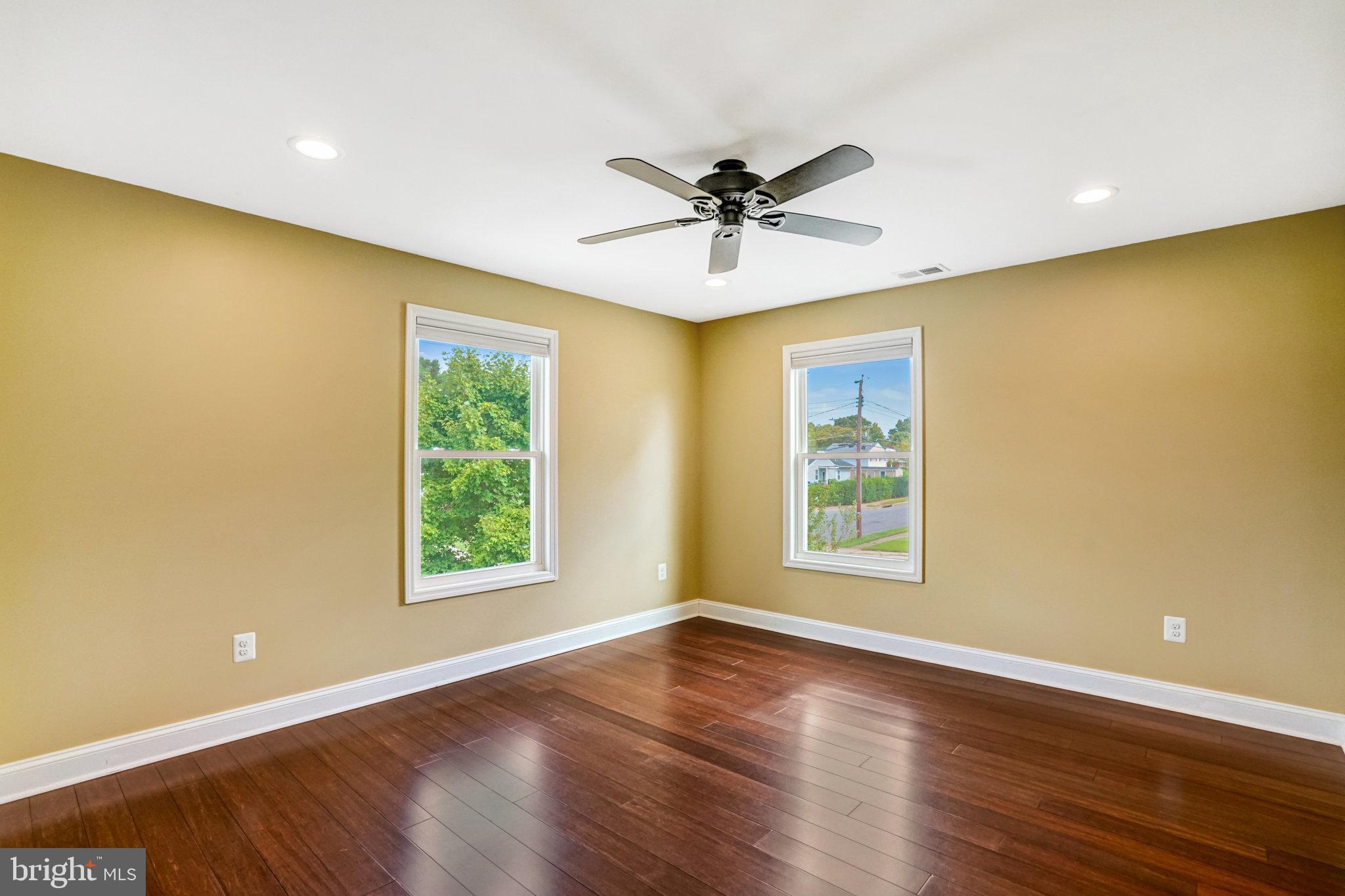 5227 Cather Road Springfield, VA 22151 - Photo 35 of 72 a view of an empty room with wooden floor and a window