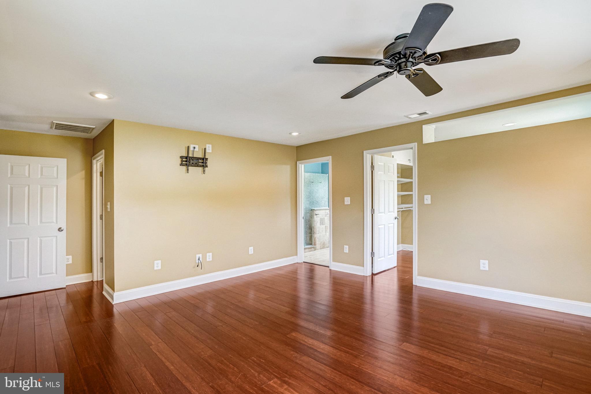 5227 Cather Road Springfield, VA 22151 - Photo 38 of 72 a view of room with wooden floor fan and windows