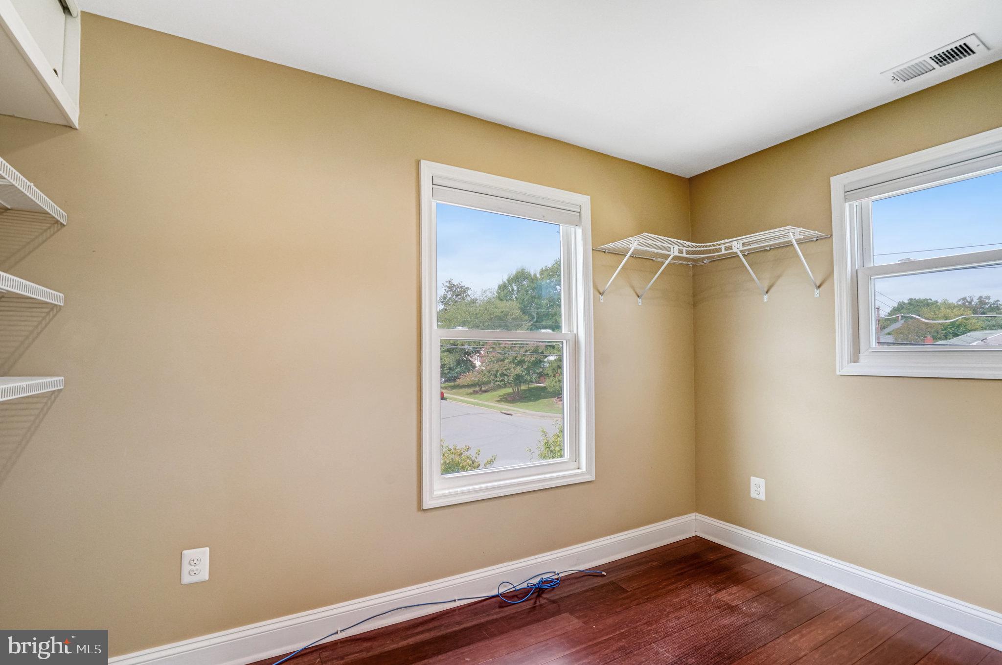 5227 Cather Road Springfield, VA 22151 - Photo 42 of 72 a view of a small space with wooden floor and a window