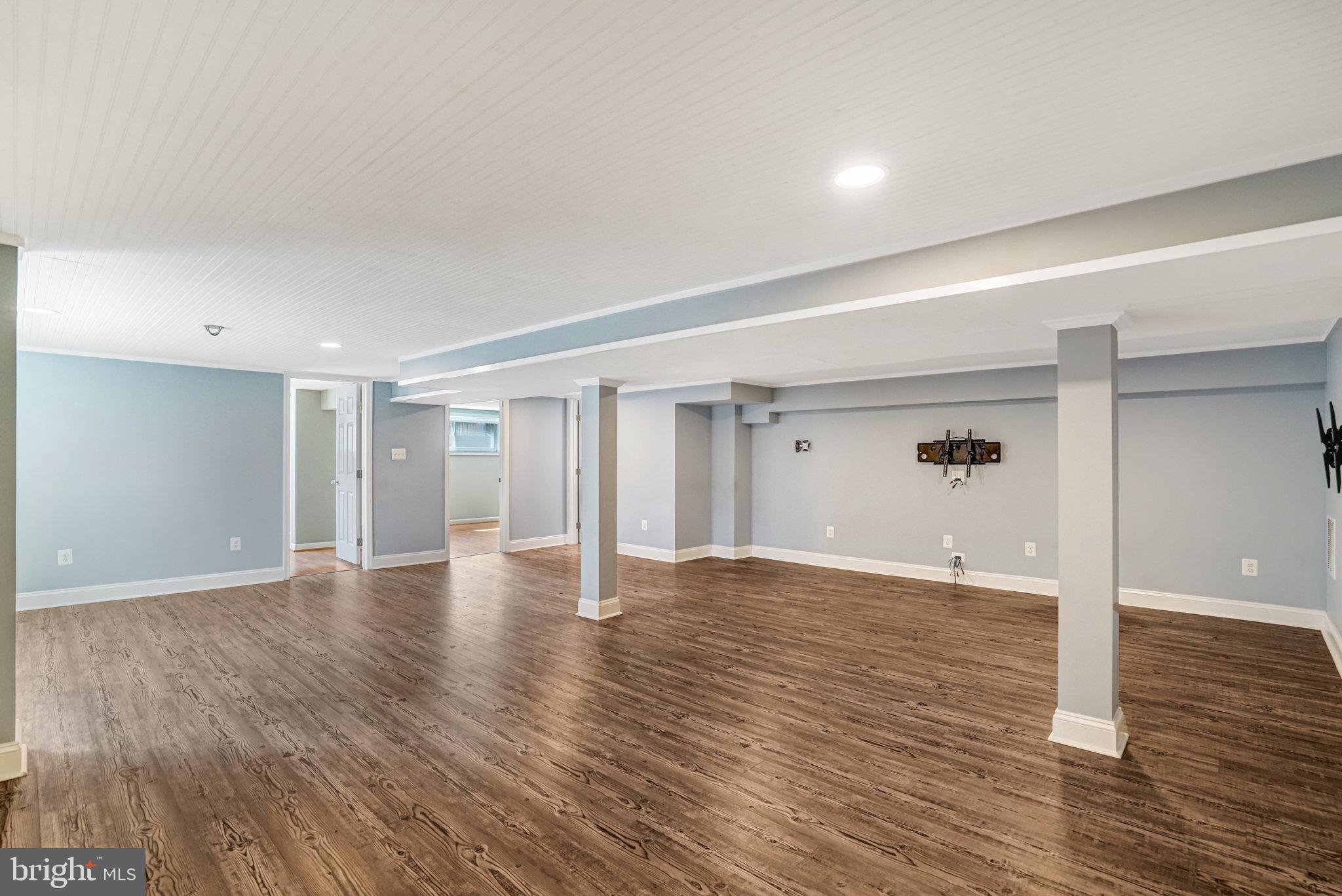 5227 Cather Road Springfield, VA 22151 - Photo 48 of 72 a view of an empty room with wooden floor