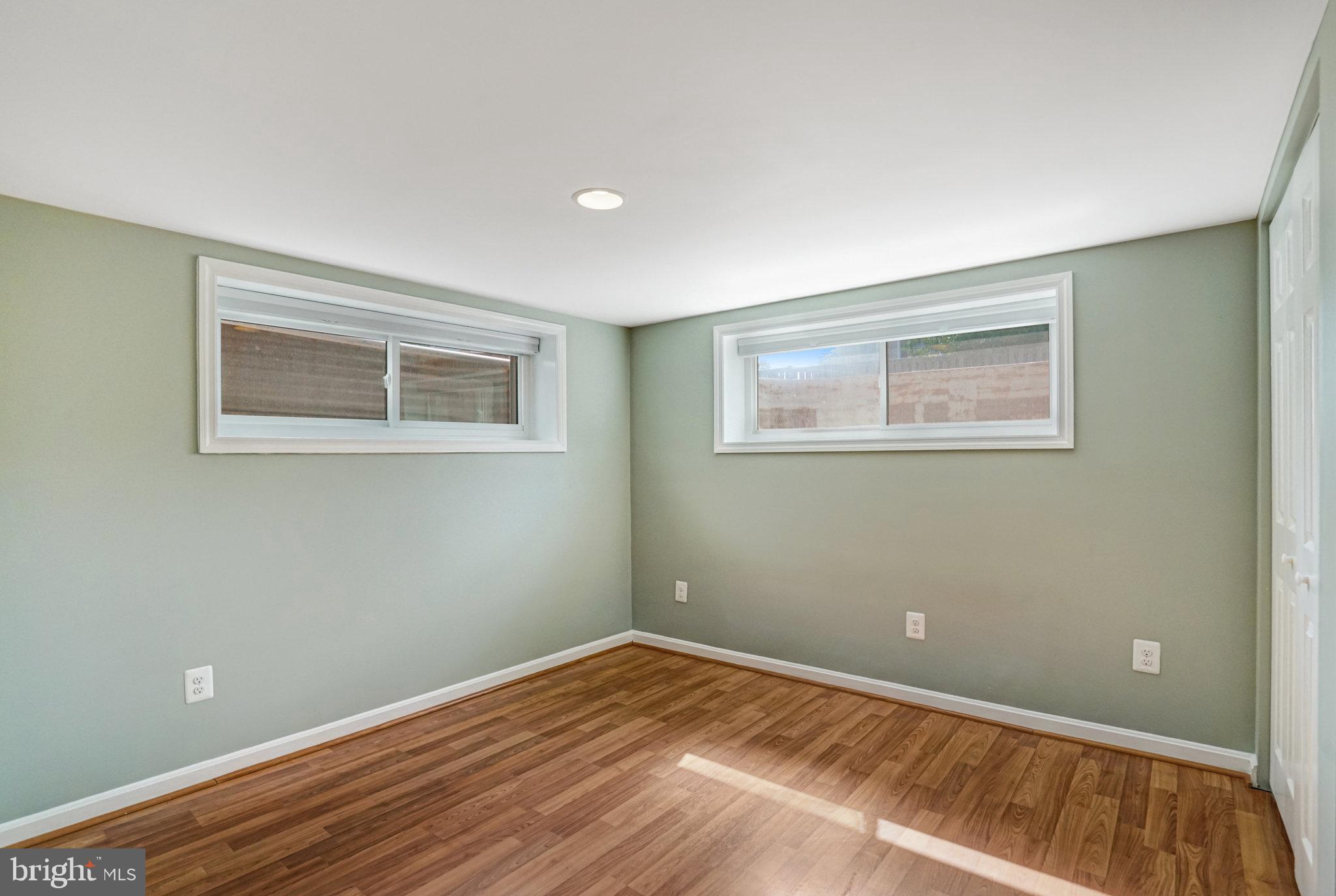 5227 Cather Road Springfield, VA 22151 - Photo 52 of 72 a view of a room with wooden floor and closet