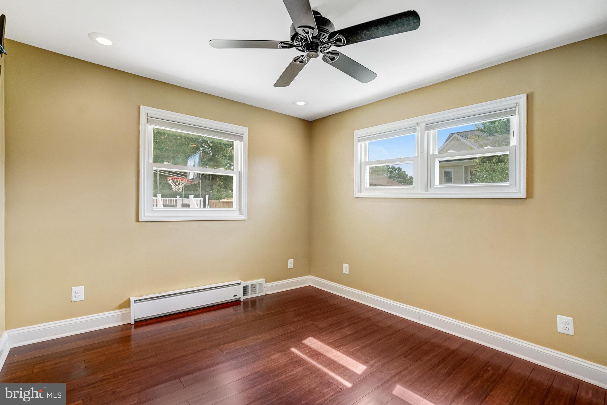 5227 Cather Road Springfield, VA 22151 - Photo 6 of 72 a view of room with wooden floor and ceiling fan