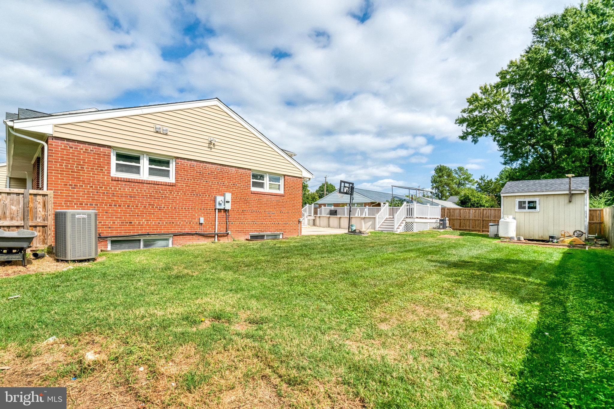 5227 Cather Road Springfield, VA 22151 - Photo 64 of 72 a backyard of a house with lots of green space