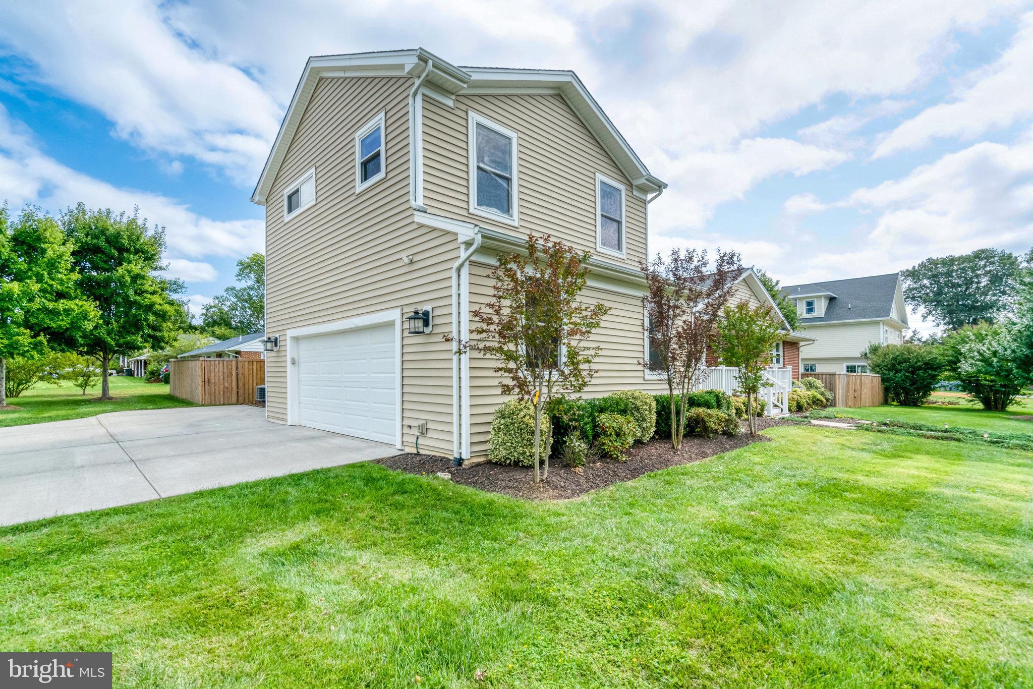 5227 Cather Road Springfield, VA 22151 - Photo 67 of 72 a view of a house with a yard and sitting area