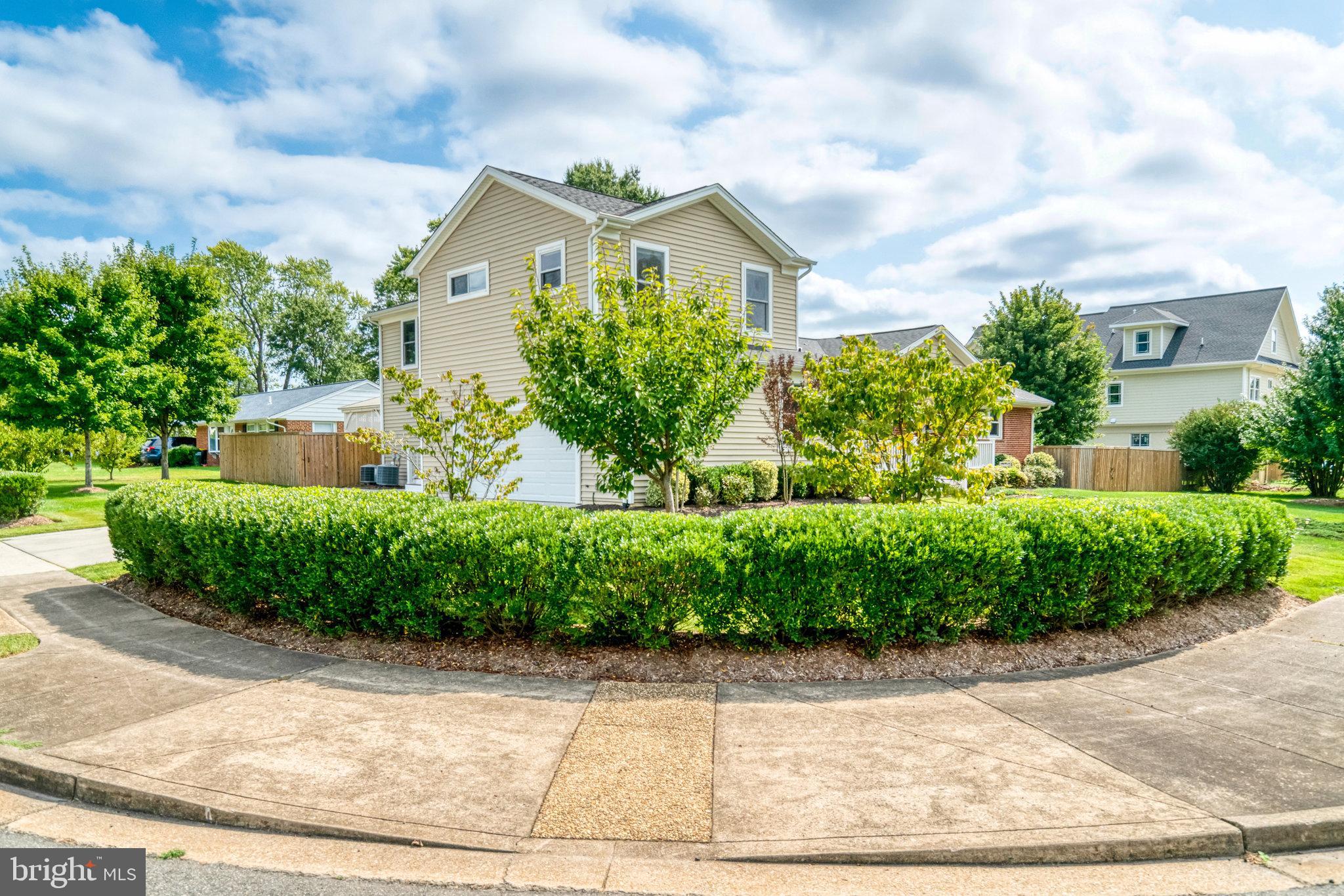 5227 Cather Road Springfield, VA 22151 - Photo 68 of 72 a front view of a house with a garden