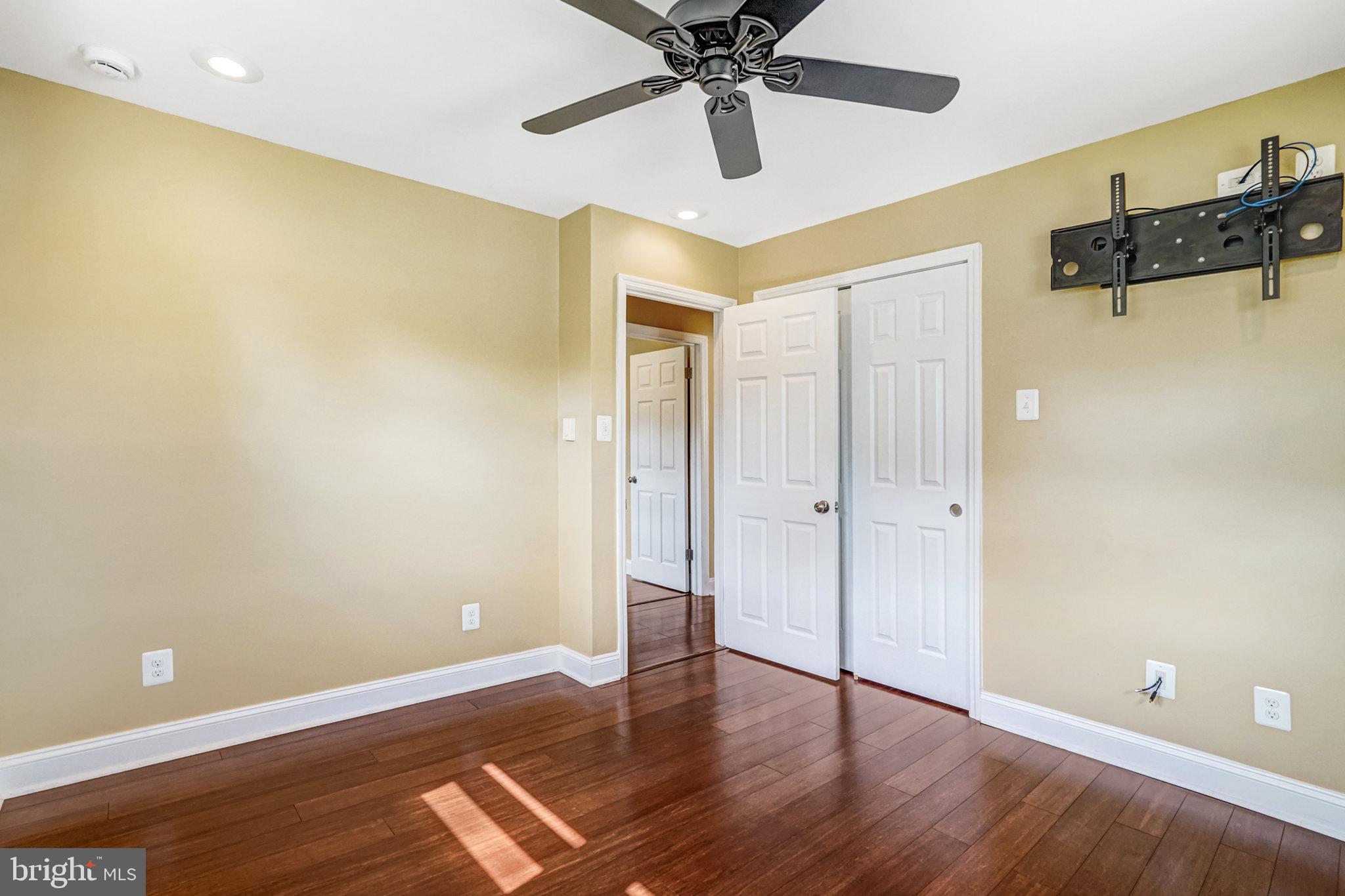 5227 Cather Road Springfield, VA 22151 - Photo 7 of 72 a view of an empty room with wooden floor