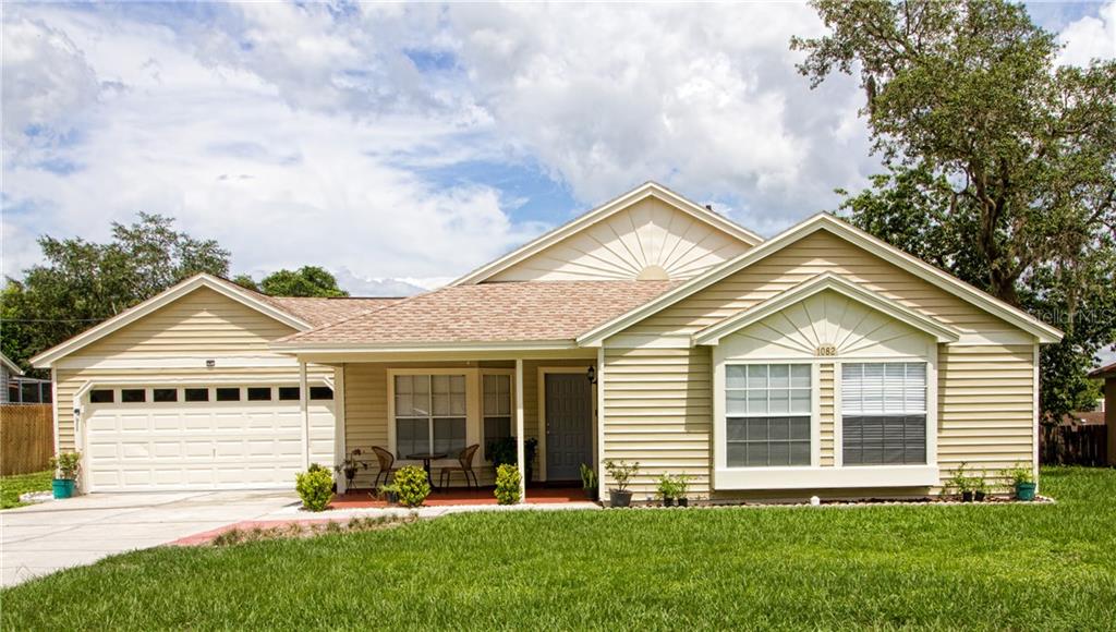 1082 Aladdin Road Spring Hill, FL 34609 - Photo 1 of 1 a view of a house with a yard and plants