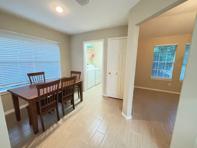 a view of a livingroom with furniture and windows
