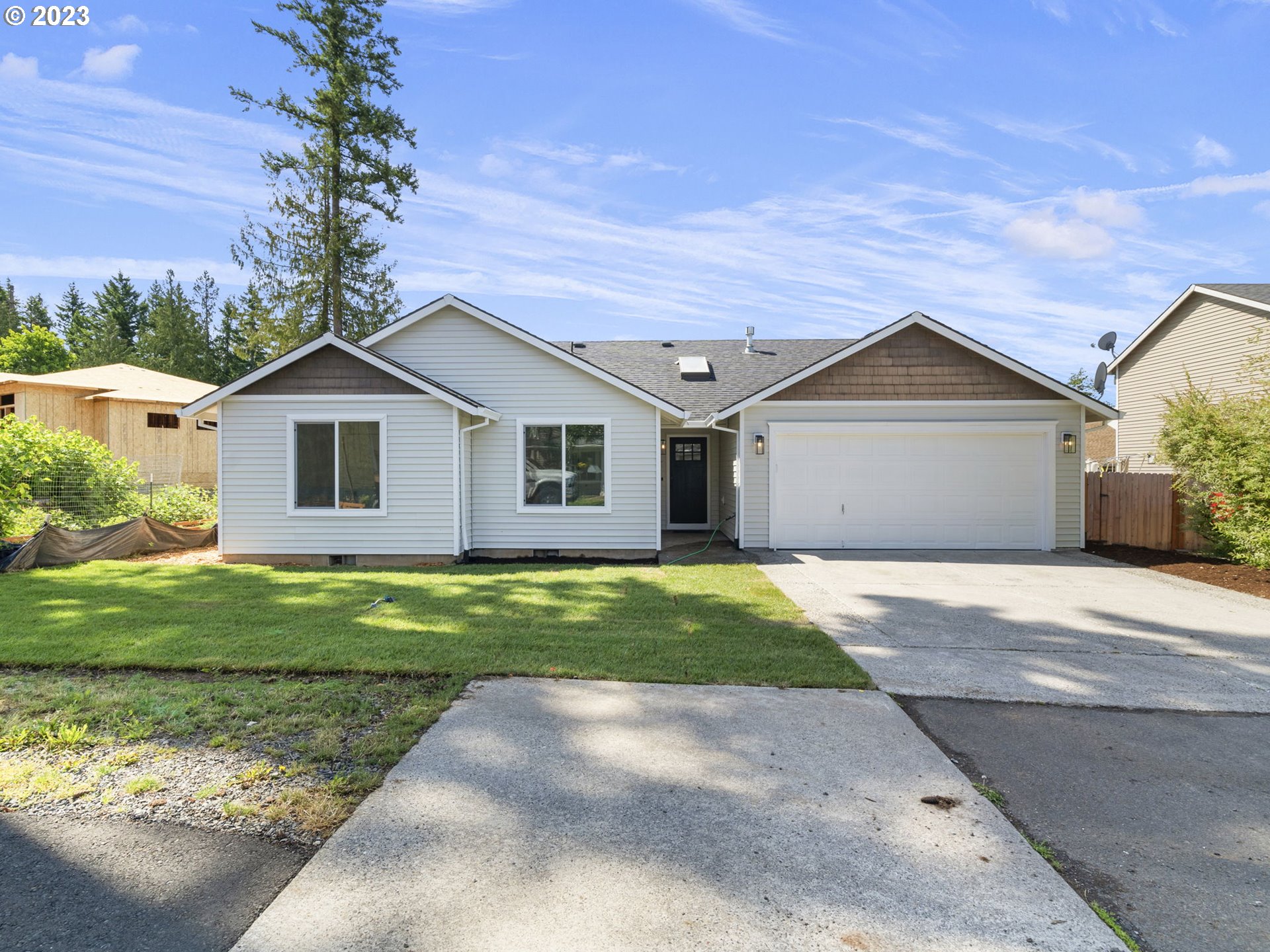 15268 Penny Avenue Sandy, OR 97055 - Photo 1 of 35 a view of a yard in front of a house with plants