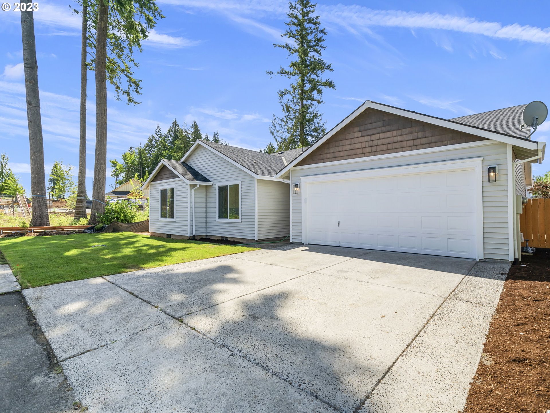 15268 Penny Avenue Sandy, OR 97055 - Photo 3 of 35 a front view of a house with garden