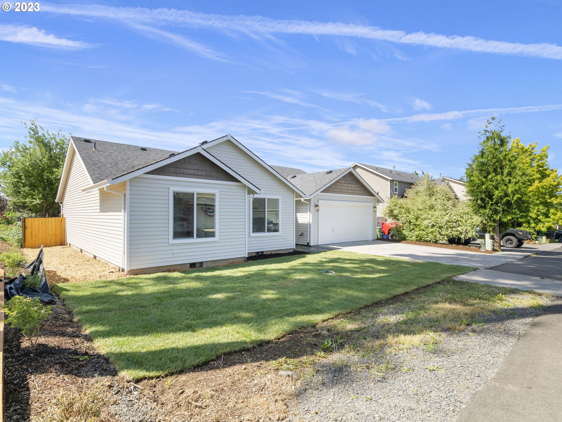 15268 Penny Avenue Sandy, OR 97055 - Photo 4 of 35 a view of a yard in front of a house with a large tree
