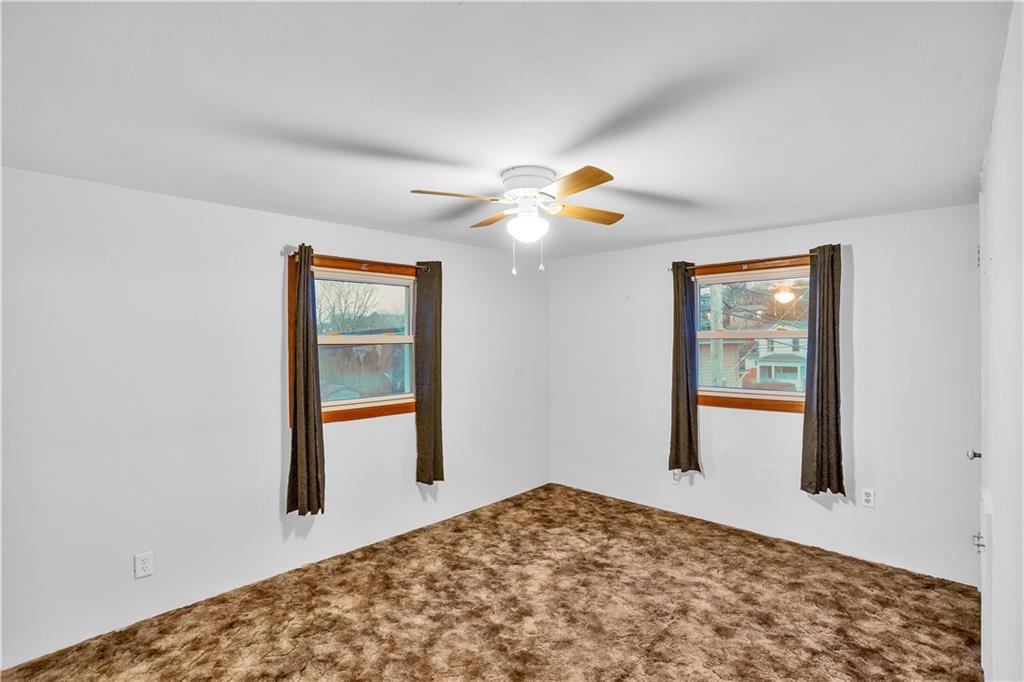 520 6th Avenue Carnegie, PA 15106 - Photo 20 of 25 a bedroom with a bed and a window