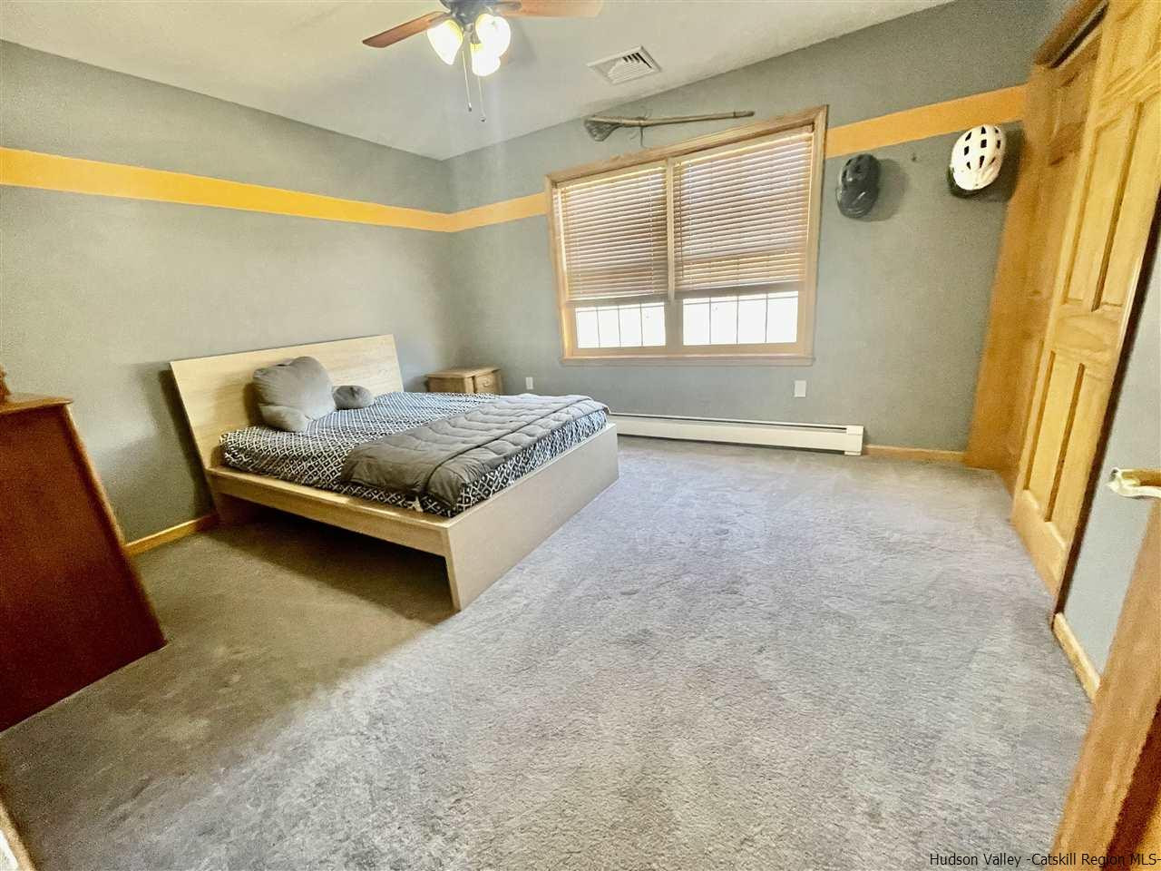 3 Knolls Road, Unit 1 Wallkill, NY 12589 - Photo 22 of 33 a bedroom with a bed and a window