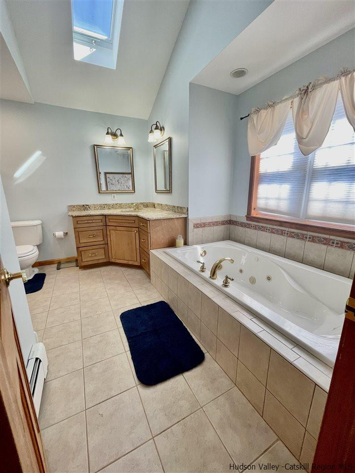 3 Knolls Road, Unit 1 Wallkill, NY 12589 - Photo 26 of 33 a bathroom with a bathtub and a window