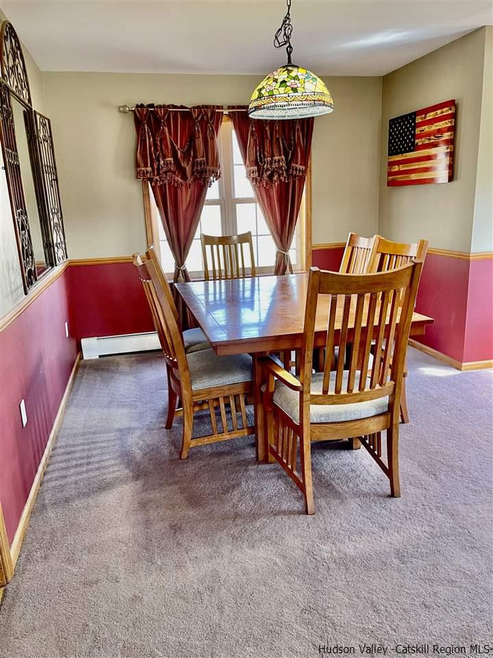 3 Knolls Road, Unit 1 Wallkill, NY 12589 - Photo 7 of 33 a dining room with furniture and a chandelier