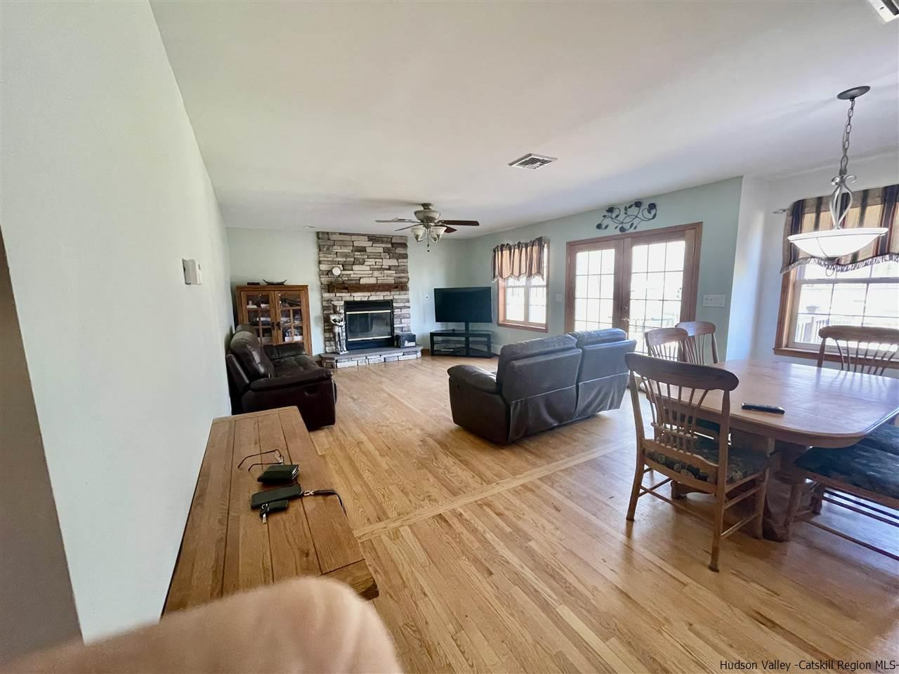 3 Knolls Road, Unit 1 Wallkill, NY 12589 - Photo 8 of 33 a living room with furniture and a flat screen tv