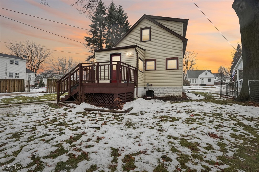 1573 Roselawn Road Cleveland, OH 44124 - Photo 24 of 25 Snow covered rear of property featuring a wooden deck