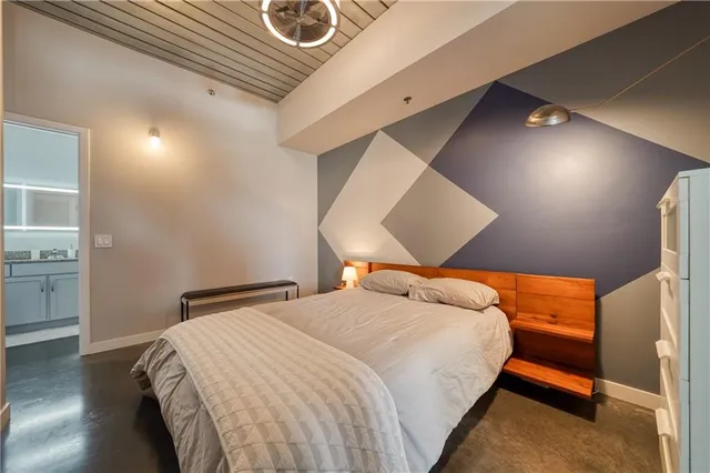 a bedroom with a bed and a cabinets