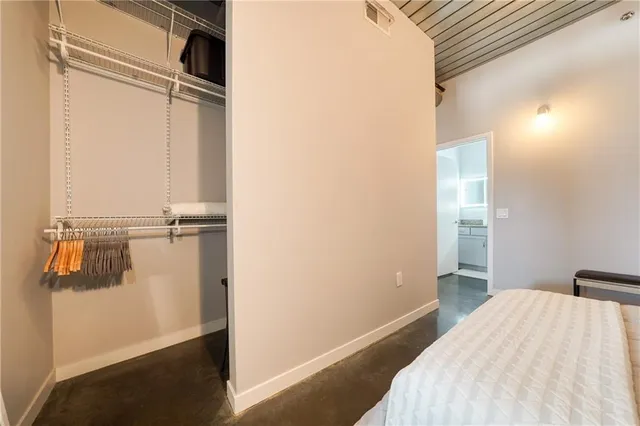 a bedroom with a bed and a view of bathroom