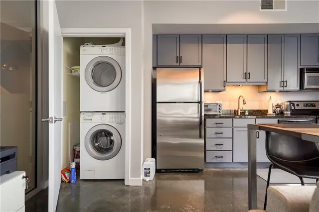 a kitchen with a washer and dryer