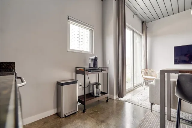 a view of a livingroom with furniture and a flat screen tv