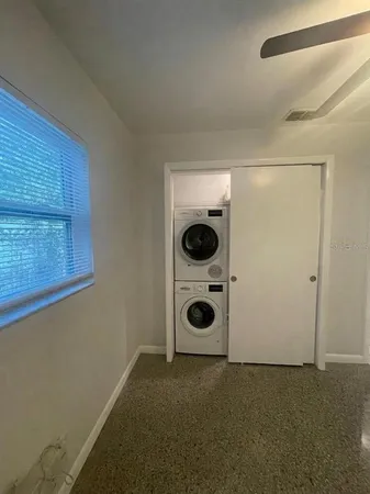 a view of a storage and utility room with a window