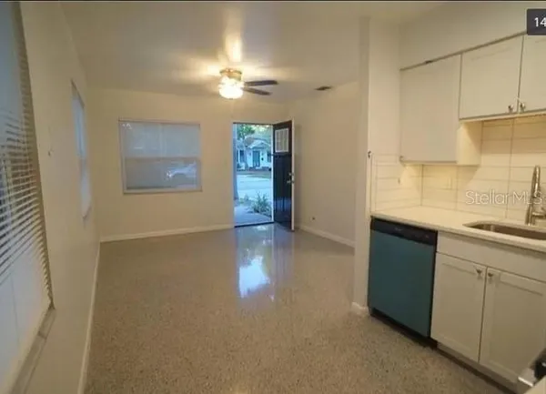 a kitchen with a sink and cabinets