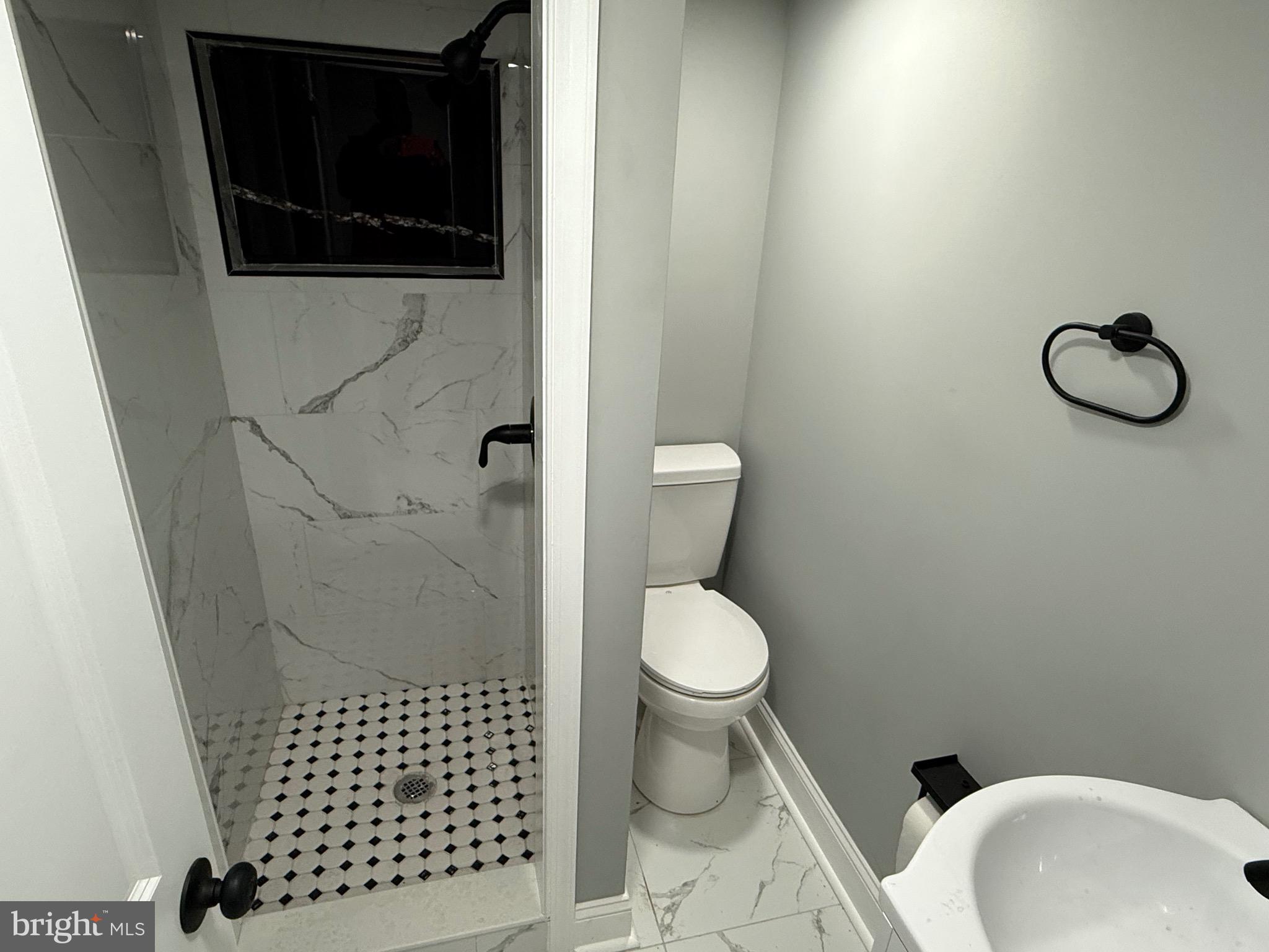 2122 West Toronto Street Philadelphia, PA 19132 - Photo 101 of 112 a bathroom with a toilet and a sink