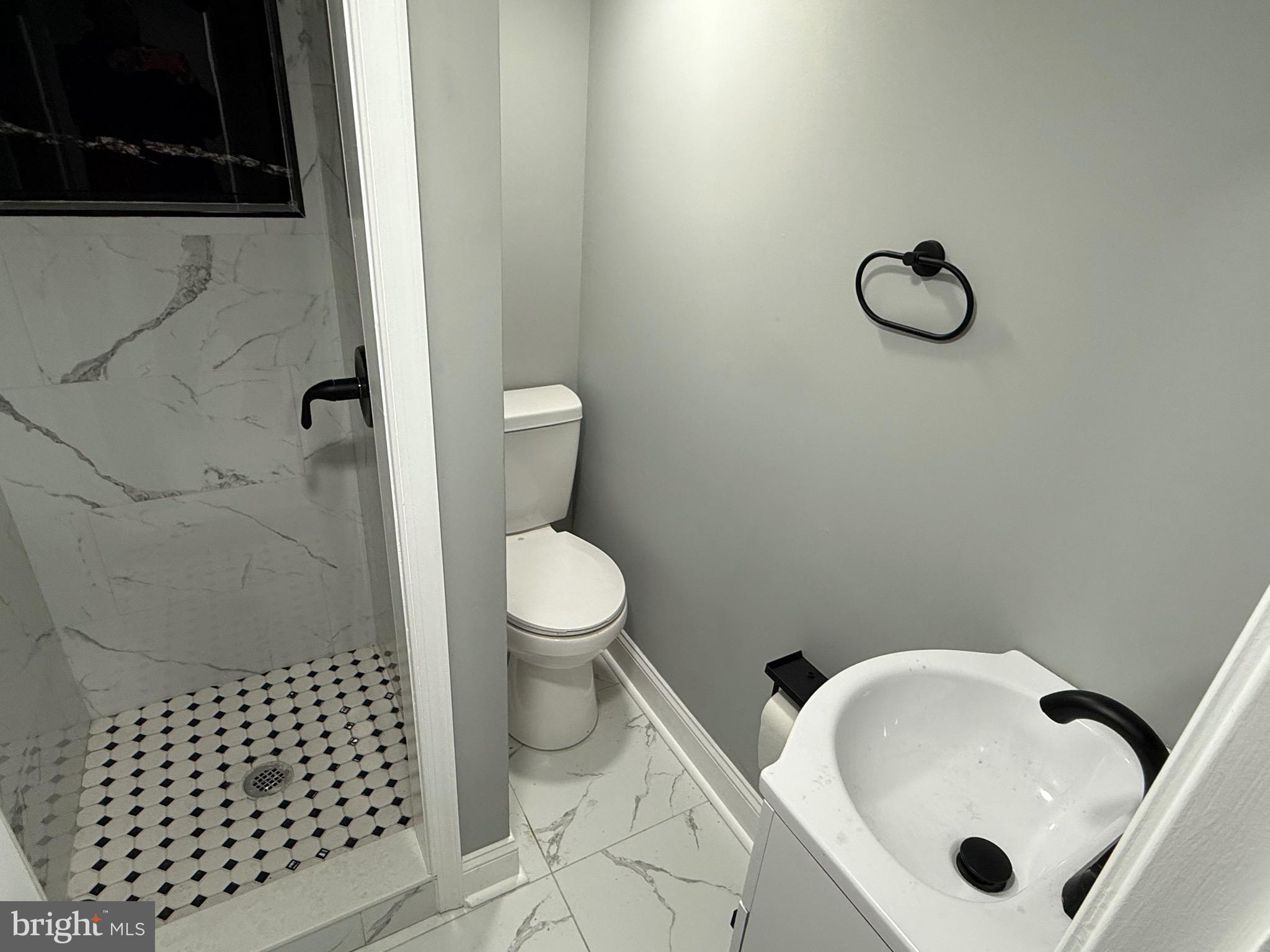 2122 West Toronto Street Philadelphia, PA 19132 - Photo 104 of 112 a bathroom with a sink toilet and shower