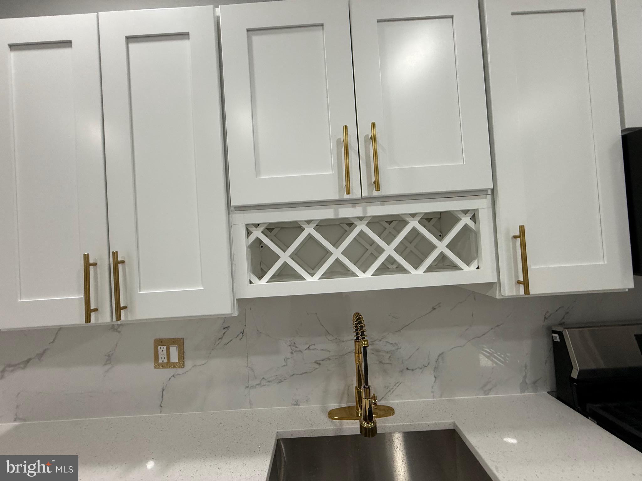 2122 West Toronto Street Philadelphia, PA 19132 - Photo 26 of 112 a bathroom with a sink and a mirror