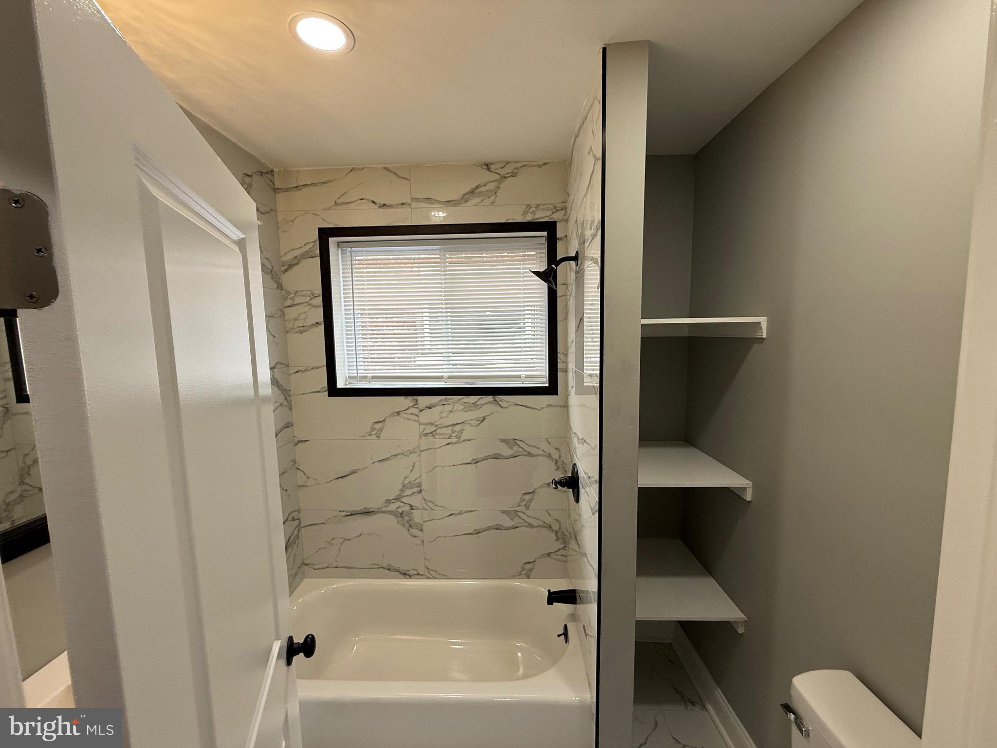 2122 West Toronto Street Philadelphia, PA 19132 - Photo 68 of 112 a bathroom with a bathtub and a toilet