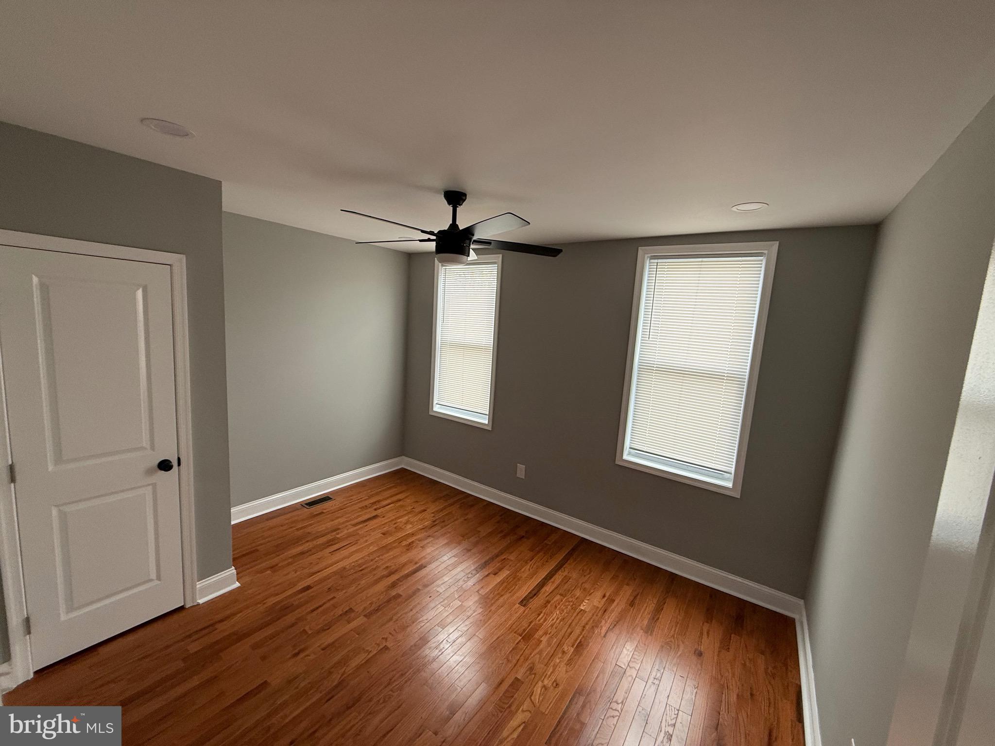 2122 West Toronto Street Philadelphia, PA 19132 - Photo 83 of 112 a view of an empty room with wooden floor and a window