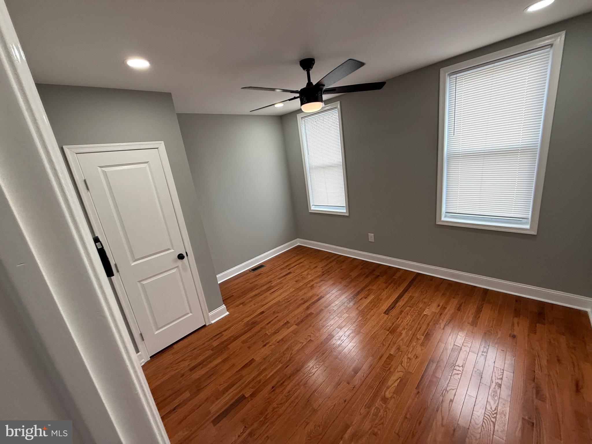 2122 West Toronto Street Philadelphia, PA 19132 - Photo 85 of 112 an empty room with wooden floor and windows