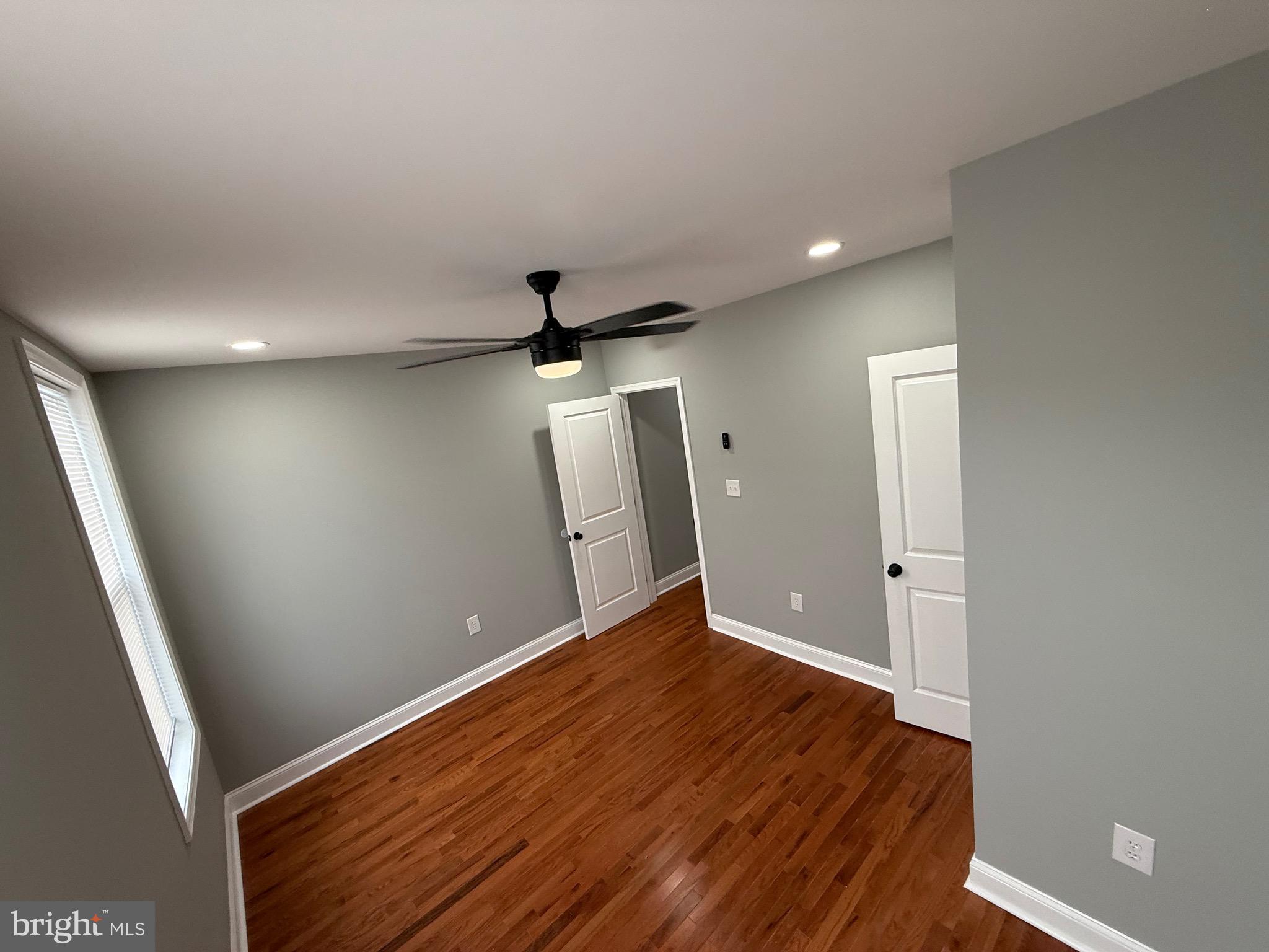 2122 West Toronto Street Philadelphia, PA 19132 - Photo 87 of 112 wooden floor in an empty room with a window