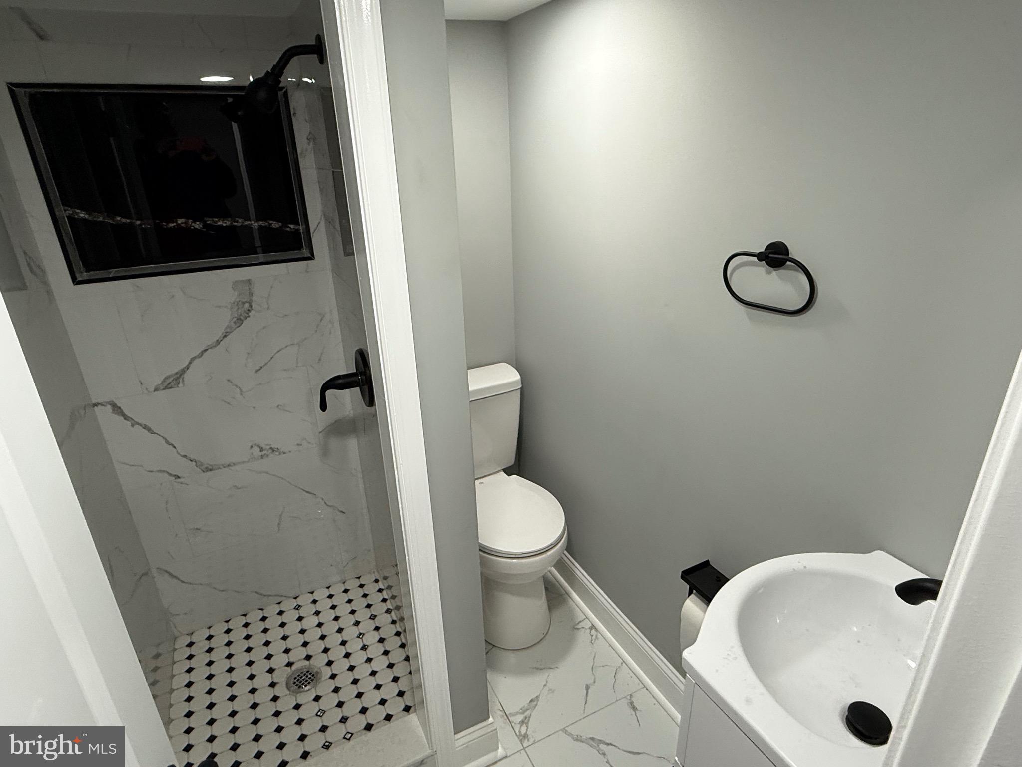 2122 West Toronto Street Philadelphia, PA 19132 - Photo 97 of 112 a bathroom with a toilet and a shower