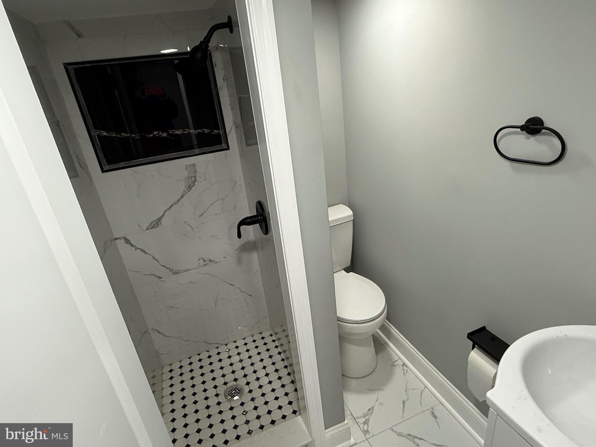 2122 West Toronto Street Philadelphia, PA 19132 - Photo 99 of 112 a bathroom with a toilet and a shower
