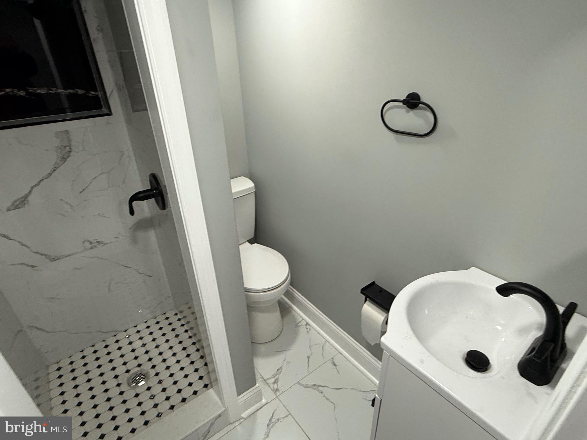 2122 West Toronto Street Philadelphia, PA 19132 - Photo 100 of 112 a bathroom with a sink toilet and shower