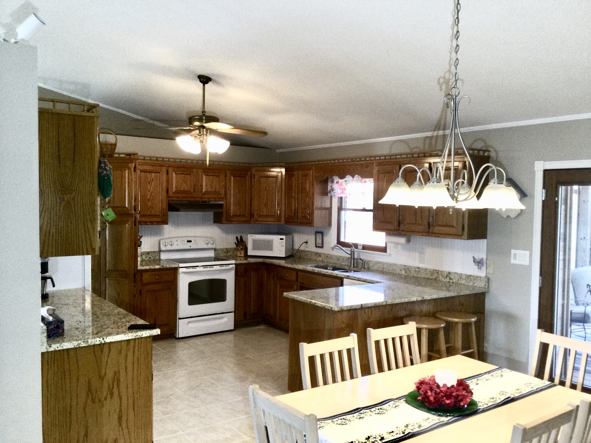 463 Dripping Springs Road Winchester, TN 37398 - Photo 13 of 25 a kitchen with stainless steel appliances granite countertop a sink stove and refrigerator