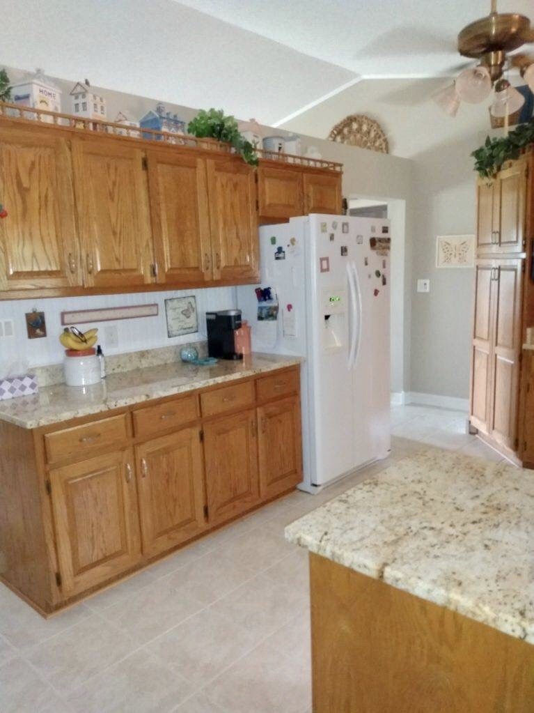 463 Dripping Springs Road Winchester, TN 37398 - Photo 16 of 25 a kitchen with stainless steel appliances granite countertop a sink refrigerator and cabinets
