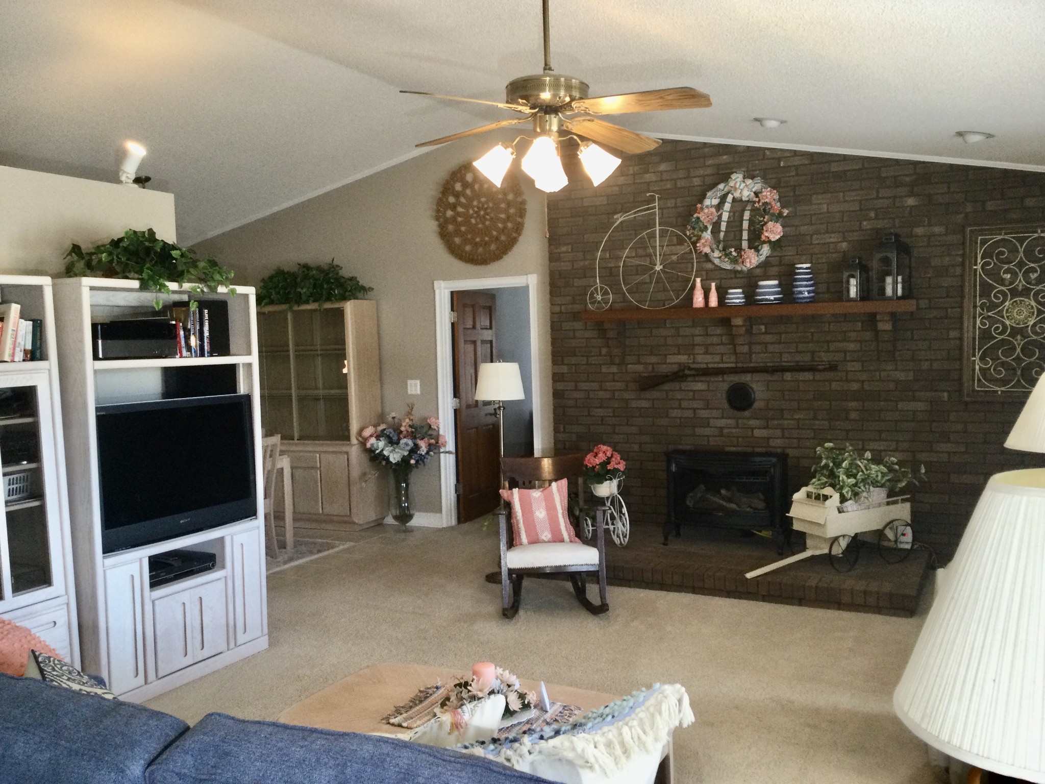 463 Dripping Springs Road Winchester, TN 37398 - Photo 7 of 25 a living room with furniture a flat screen tv and a fireplace