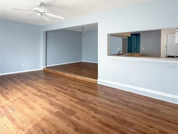 a view of a livingroom with wooden floor