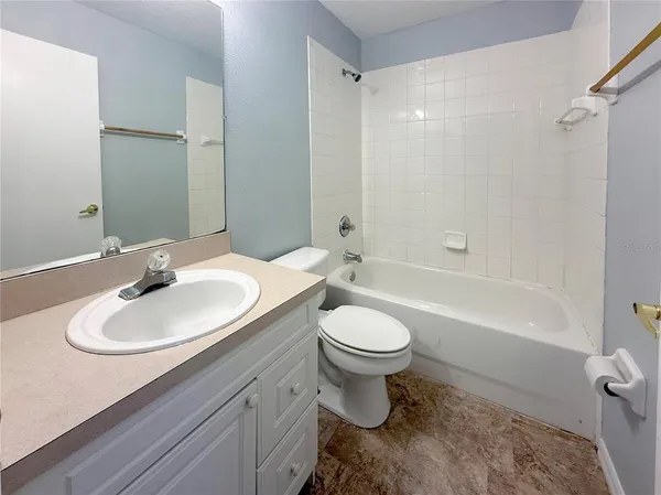 a bathroom with a sink toilet a shower and a mirror