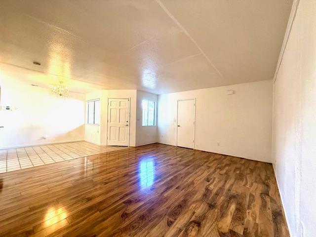 80 East Portola Way, Unit 105 Tracy, CA 95376 - Photo 3 of 12 wooden floor in an empty room