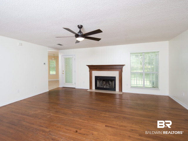18700 East River Road South Silverhill, AL 36576 - Photo 10 of 32 Spacious living area with fireplace creates the center of the home.
