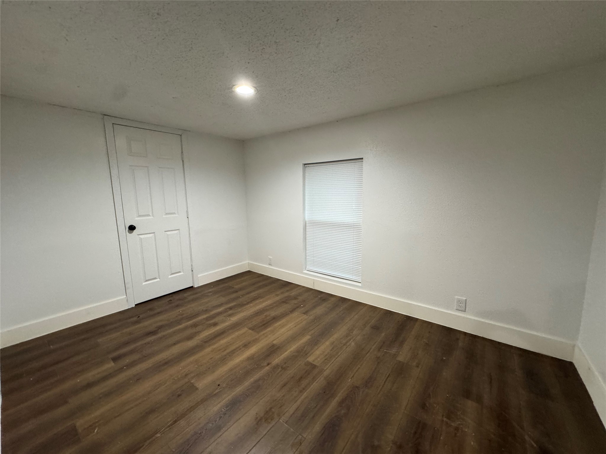 19307 Timberland Boulevard Porter, TX 77365 - Photo 3 of 9 a view of an empty room with wooden floor