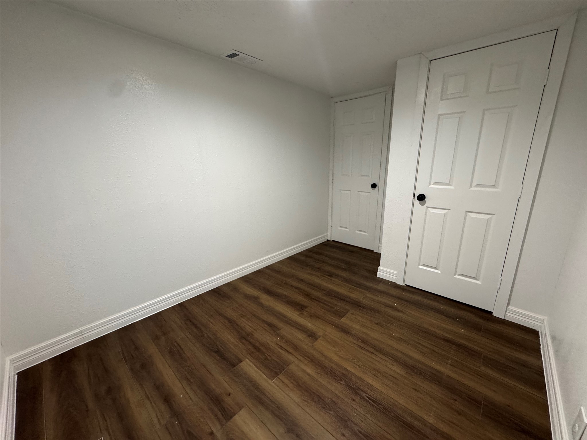 19307 Timberland Boulevard Porter, TX 77365 - Photo 4 of 9 a view of an empty room with wooden floor